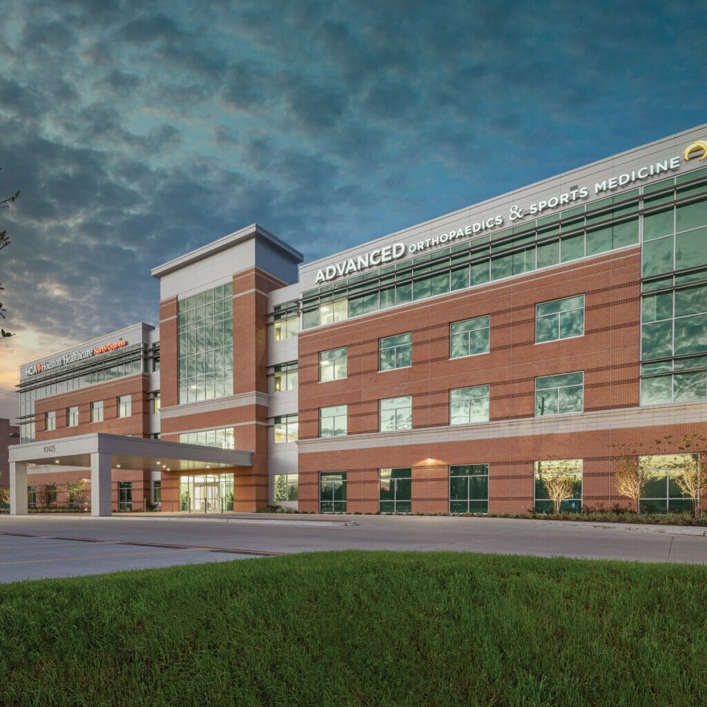 Exterior of HCA Houston Healthcare North Cypress medical office building with brick and gray exterior