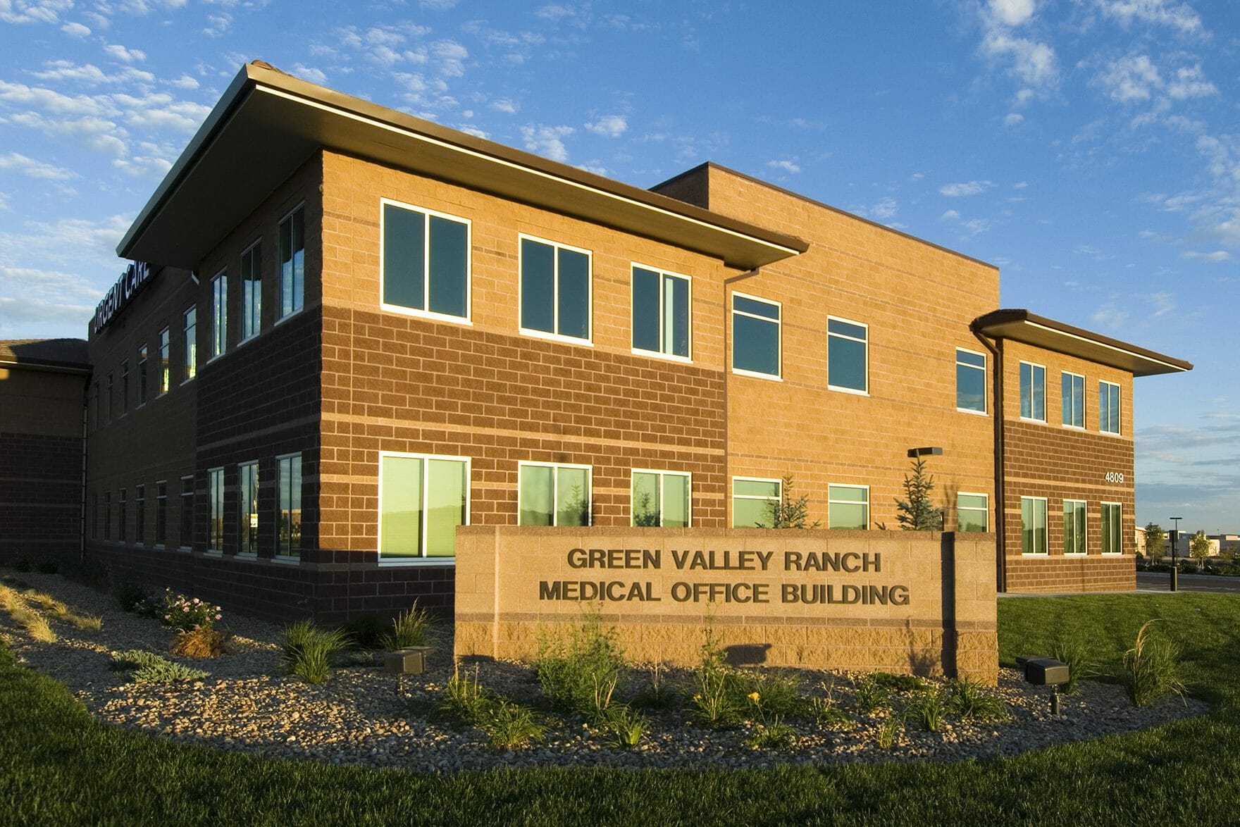 Exterior view tan and brown concrete block medical office building