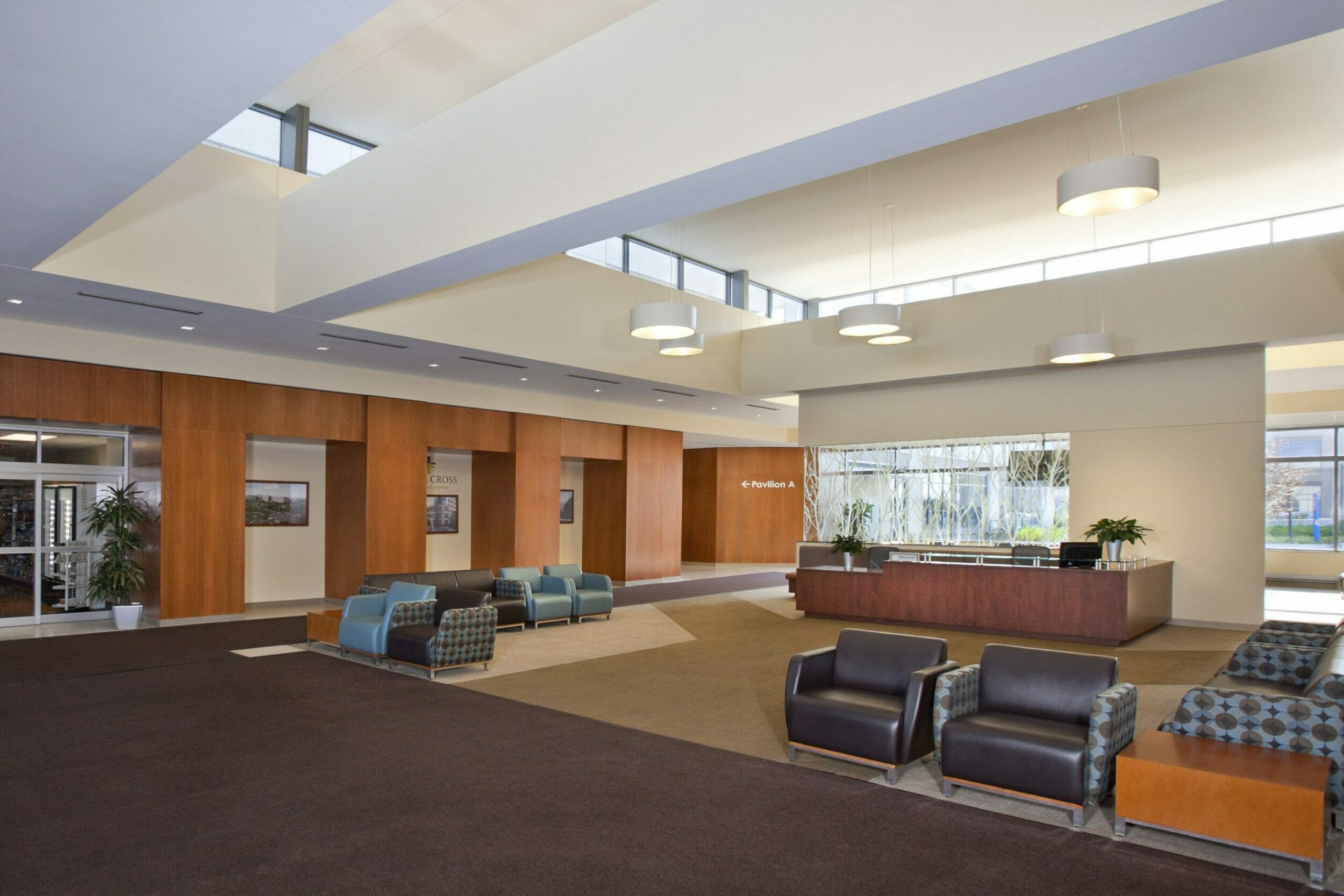 Main lobby at silver cross, leather couch and chairs, check in desk, Walgreens pharmacy entrance