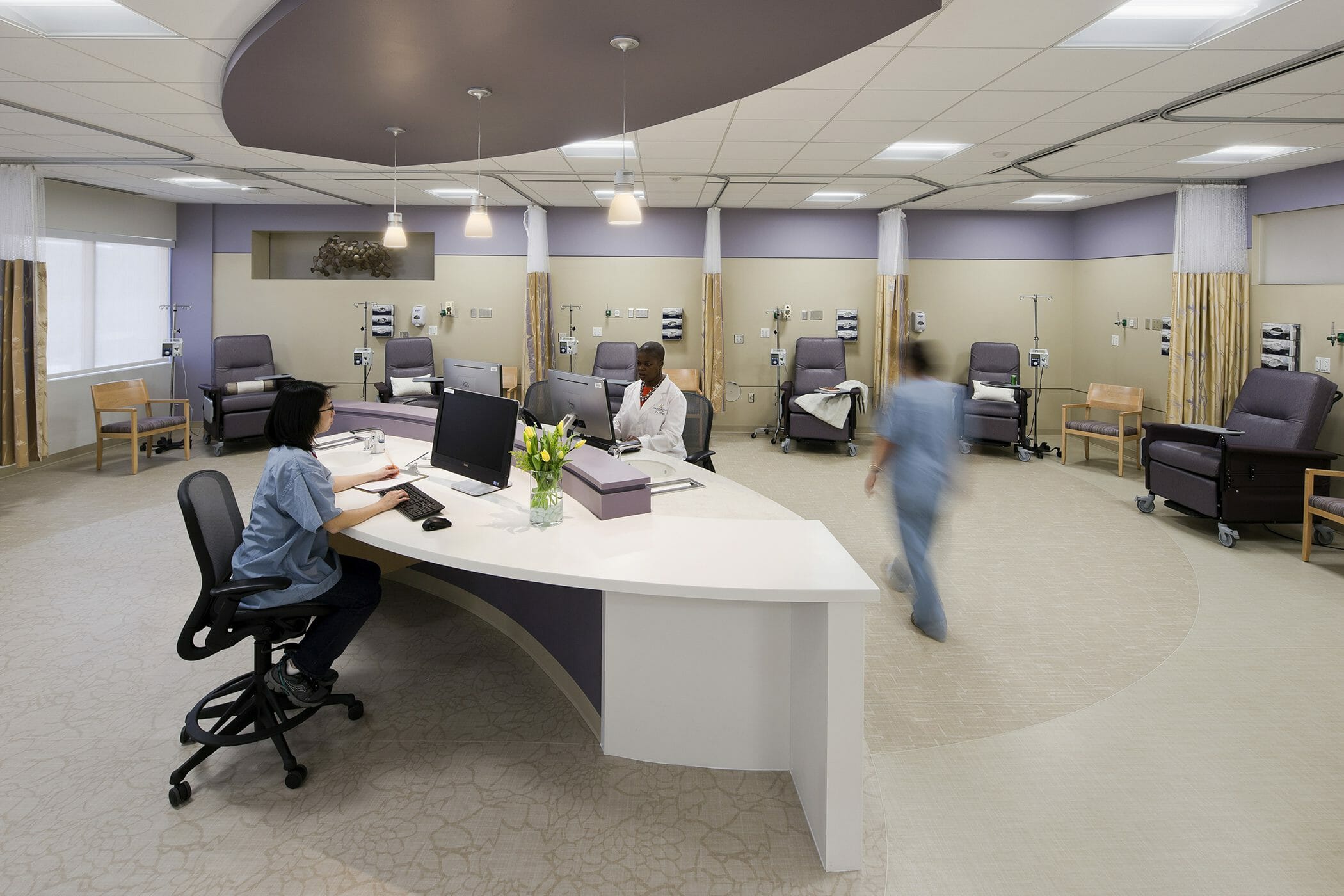 Infusion center for chemotherapy with cream and light purple walls at Angelos Medical Pavilion