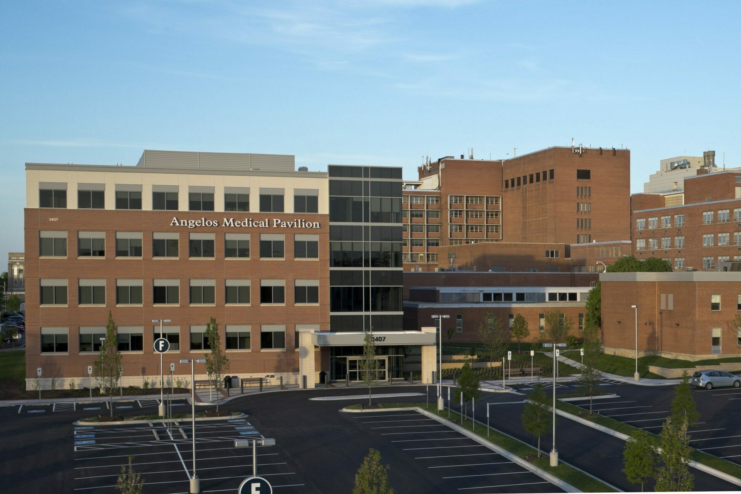 Exterior view of Angelos Medical Pavilion with a brick exterior and aerial view of the parking lot in front