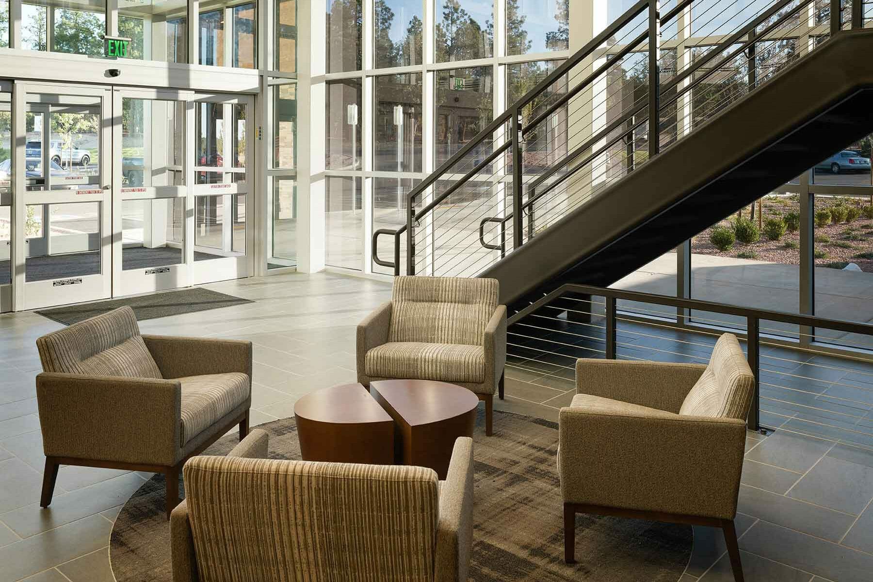 medical office building main level lobby, seating/waiting area, stairs to upper level