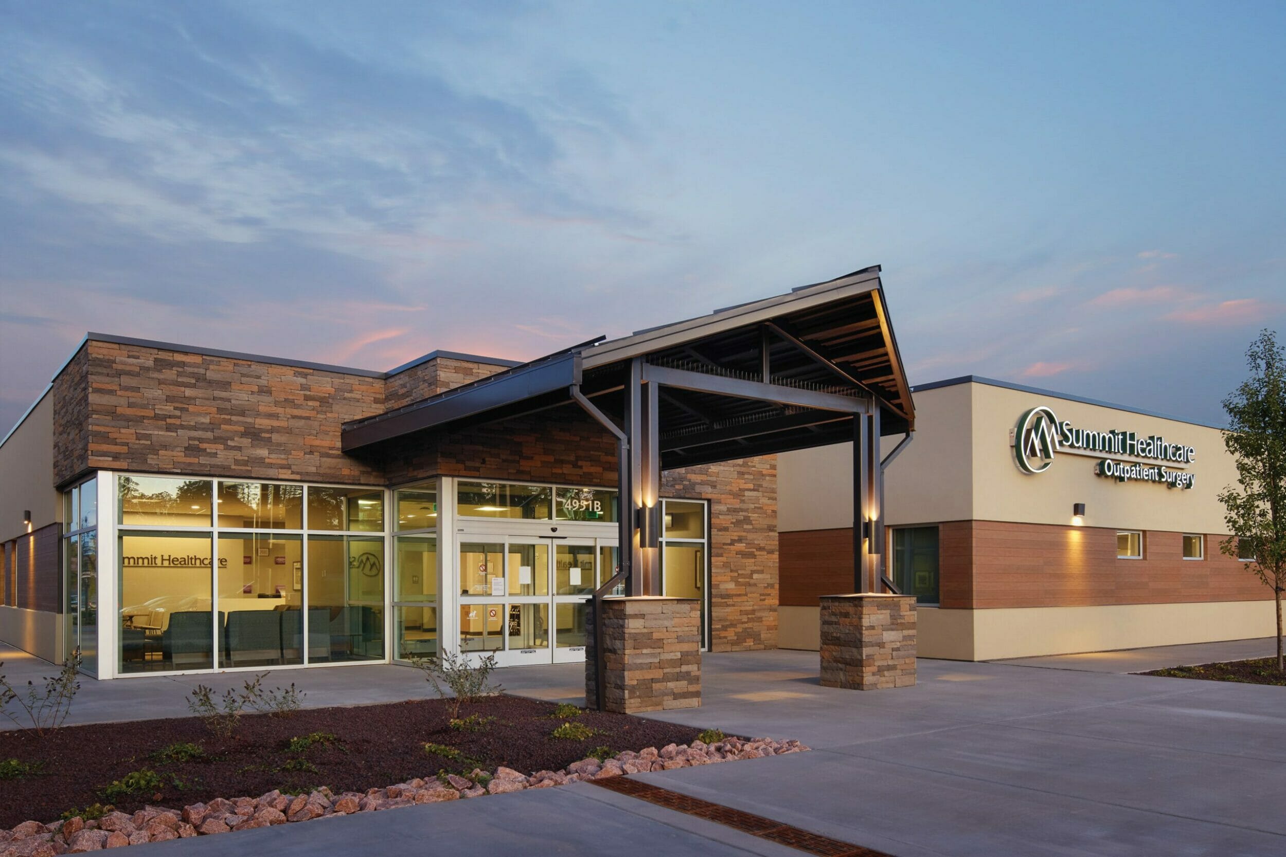 Exterior entrance to Summit Healthcare Ambulatory Surgery Center, 1-story with tan stucco and rock wall accents
