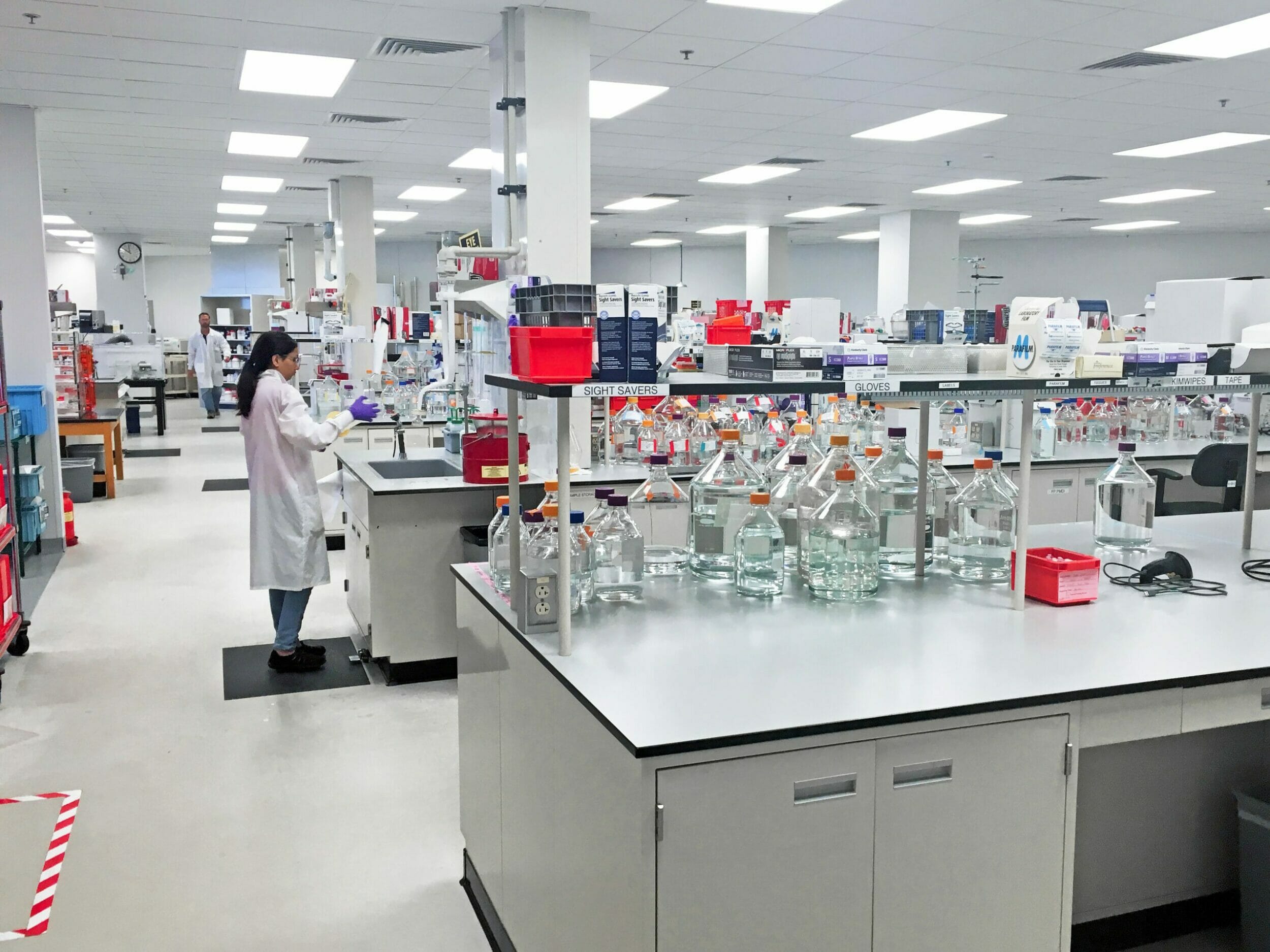 Lab space with one woman working in the lab