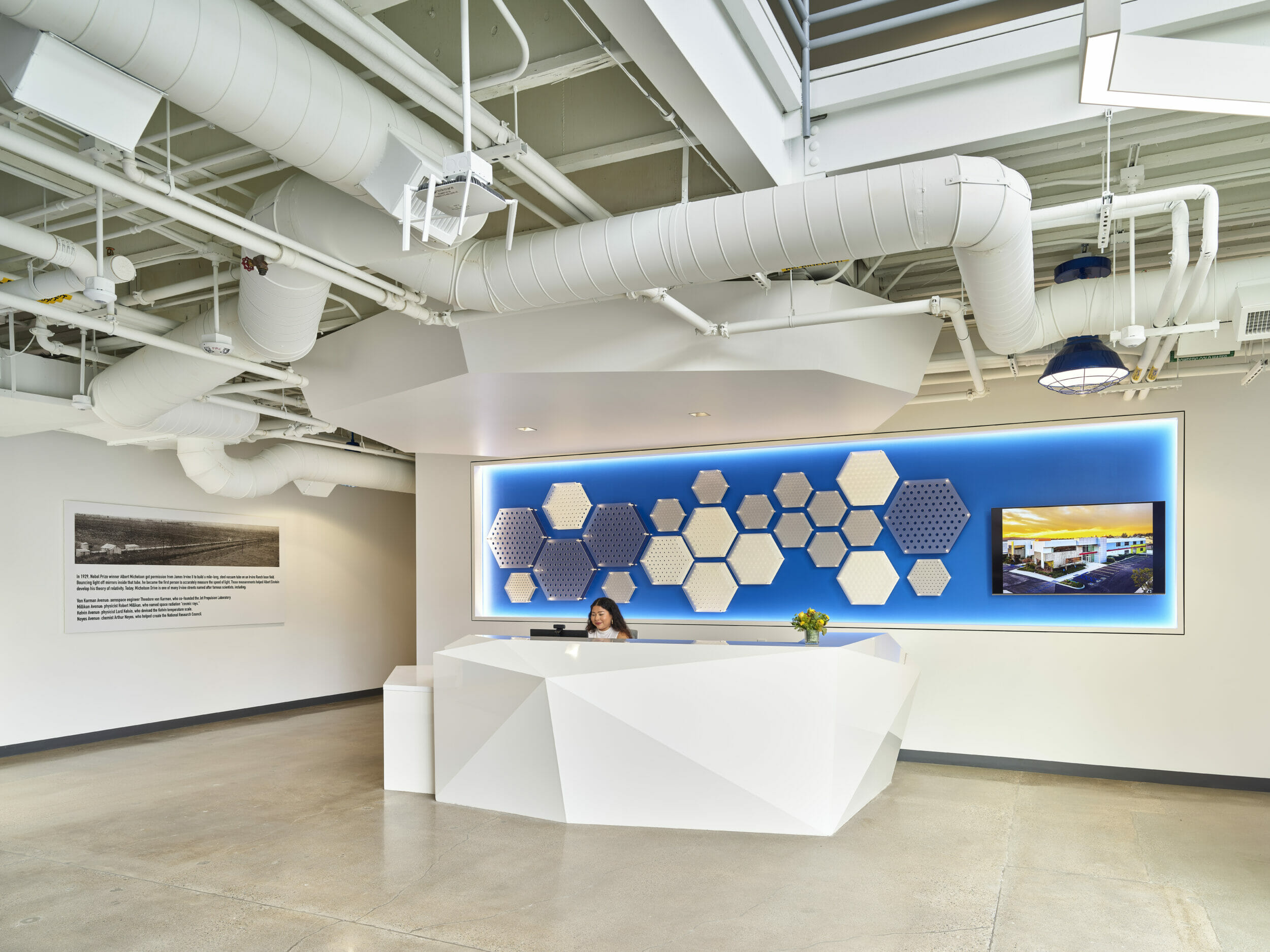 HATCHSpace lobby with receptionist desk and blue art behind the desk